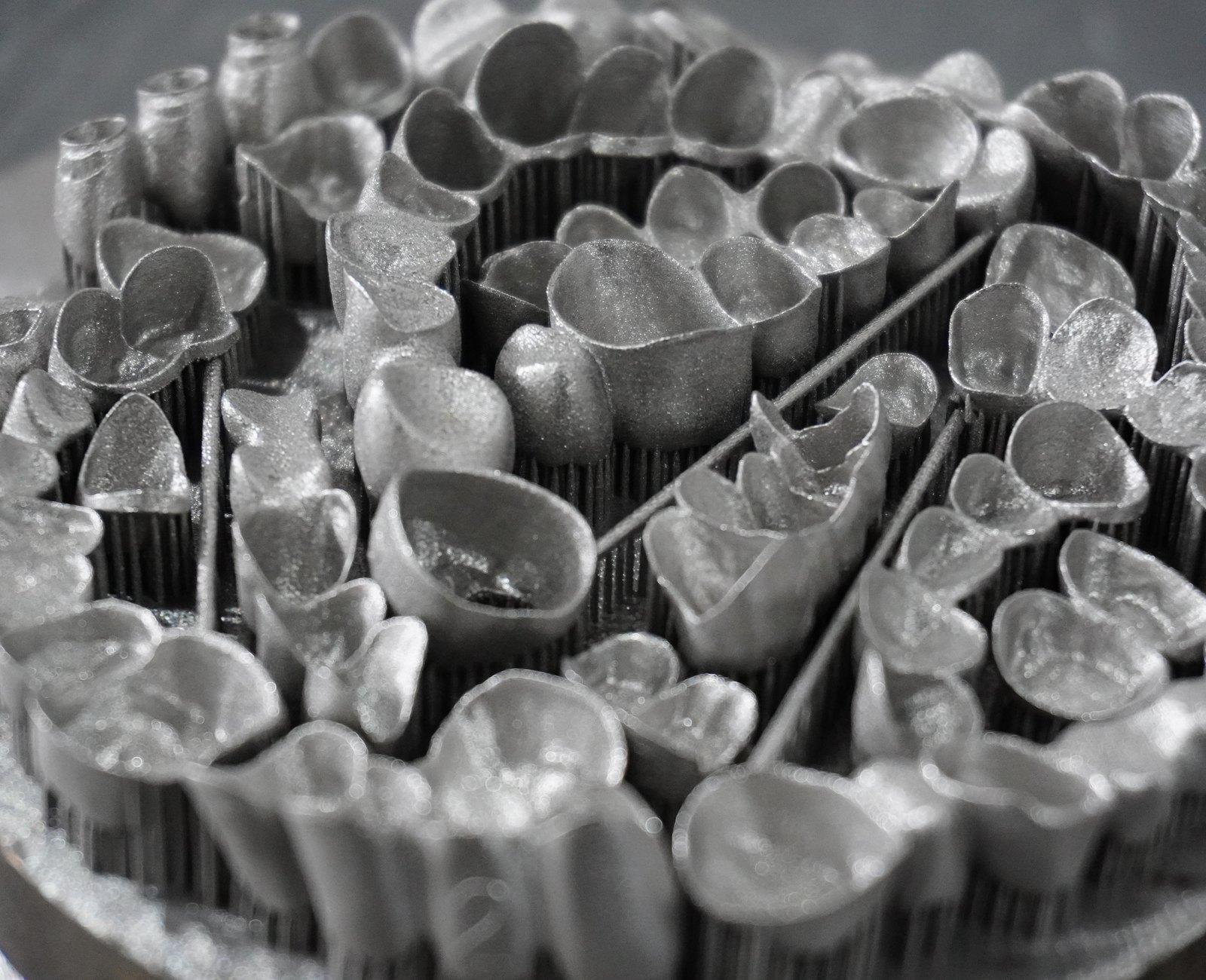 Crowns and copings packed across a build plate on their supports